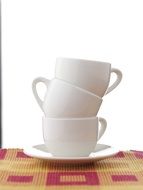 cups piled on top of each other on a plate