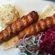 meat sticks with garnish and salad