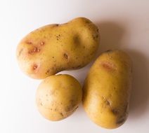 three raw potatoes