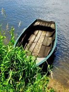 wooden boat on a calm river