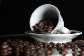 coffee grains in a white cup on a saucer