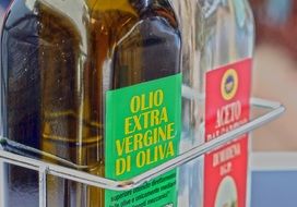 olive oil in a glass bottle and vinegar