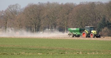 green tractor on the agricultural field, munsterland