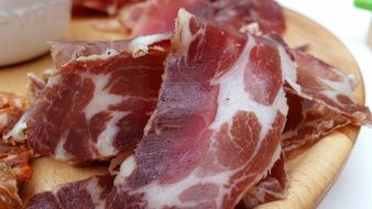 chopped jamon on a wooden board