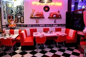 cafe with chess floor and striped furniture