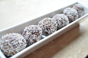 dates in a coconut on a plate