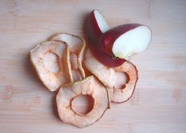 Dried rings of apple and fresh slices of the apple