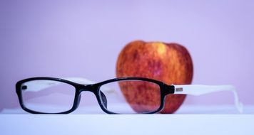 red apple and glasses