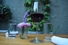 Wine, water and Flowers on table Outdoor