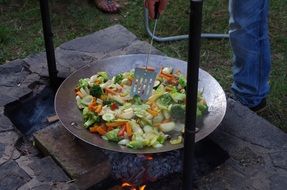 vegetables are cooked on open fire