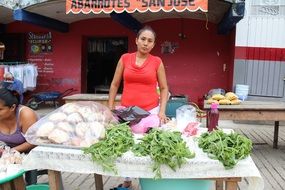 woman near counter in a market in mexico