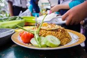 food in a plate with a pattern