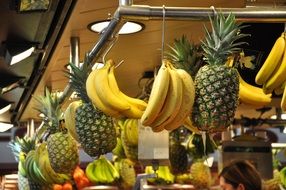 pineapples and bananas on the market