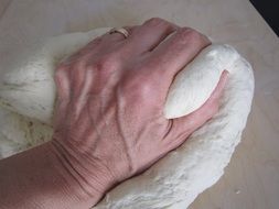 kneading dough on the table