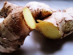 sliced ginger on a white surface