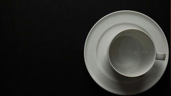 white cup and saucer