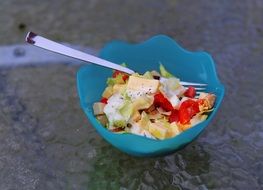 vegetables and chees Salad in blue Bowl