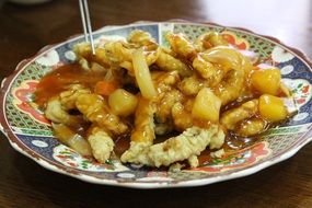 traditional Chinese dish in a colorful plate