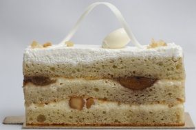 piece of a white cake with the nuts and decorations