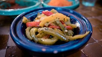 pickled bell peppers on a blue plate