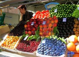 mix of fruits and vegetables on a market counter