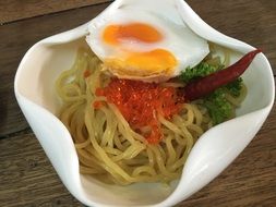 Noodle with the sauce and egg close-up