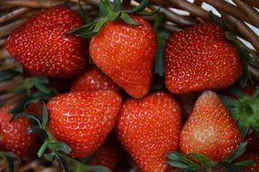 red strawberries in a wicker basket