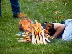 man fanning the fire