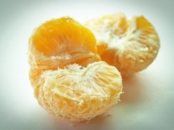 closeup photo of orange slices on a white surface