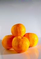 Fresh juicy healthy sweet oranges on the white background