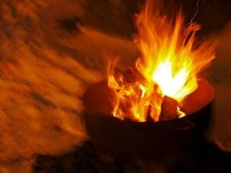 Fire in a cauldron in the dark