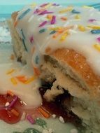 a piece of sweet donut with white fondant