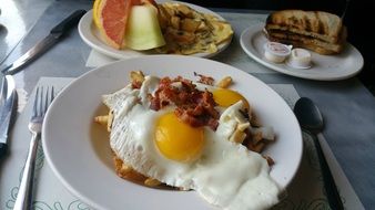 Egg with beacon,toast,waffle and fruits for breakfast