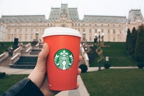 glass of coffee in a man's hand