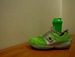 green training Sneakers and bottle