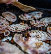 Cooking meat on the grill in the summer