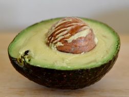 Cut in half green avocado