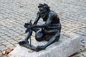 statue of a seated man