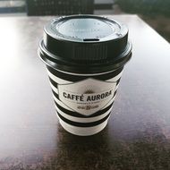 hot coffee in a black and white glass