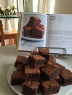 chocolate brownies on a white plate