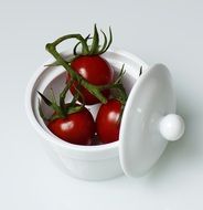 red Tomatoes in white bowl