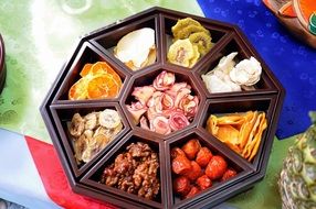 Gujeolpan, korean dish from nine different foods on wooden plate