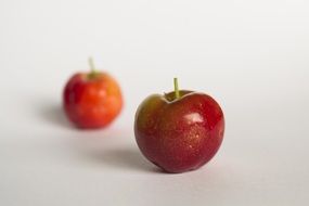 red apples on white background in a blurred background