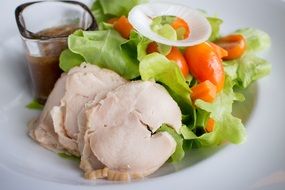 chicken with bright salad close up