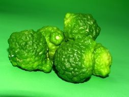 fresh green Bergamot Fruit on green surface