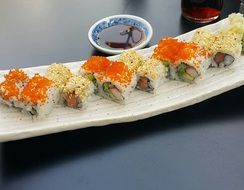 sushi with sauce on a plate