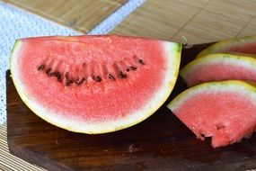 red watermelon on a wooden board