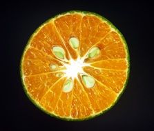 orange slice on the black background