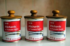 three cans of canned fish