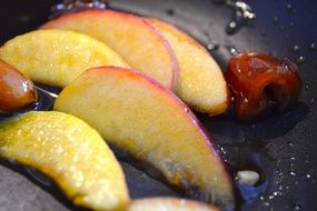 slices of Peach Cooking on Barbecue